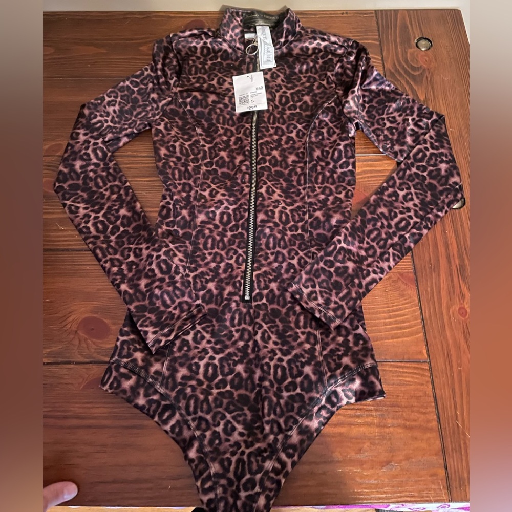 Forever 21 polyester and spandex leopard zip up collar leotard. Size small.
